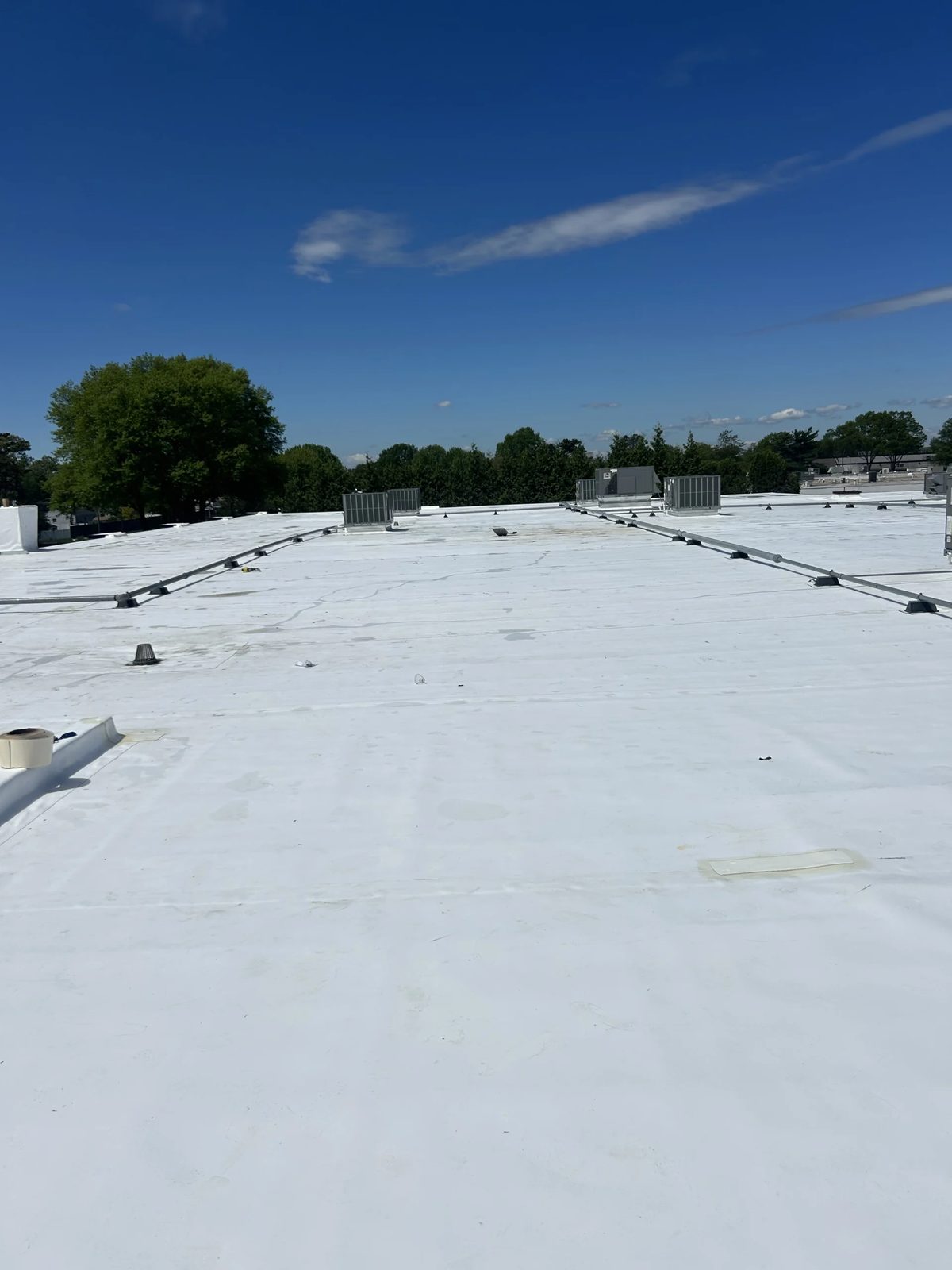 Flat roof membrane and rooftop HVAC on a commercial roofing St Louis building