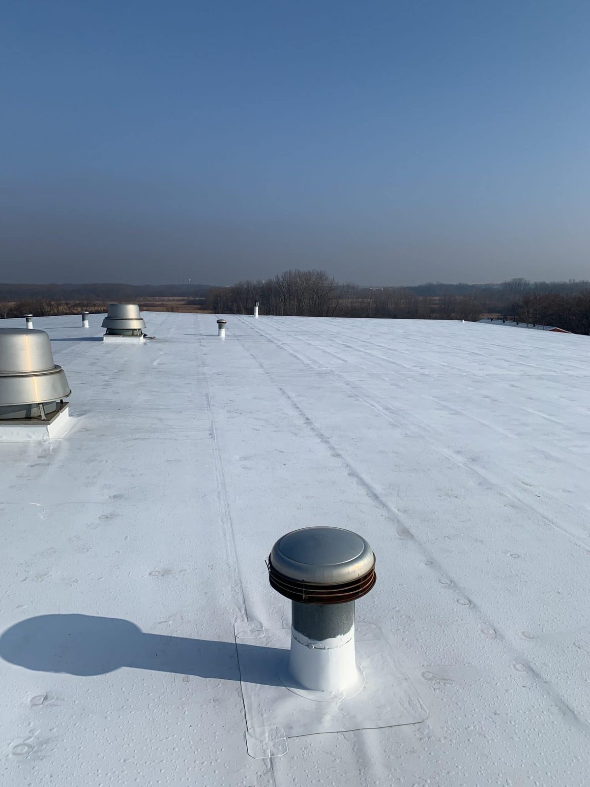TPO roof vents and skylights on a commercial roofing St Louis flat roof